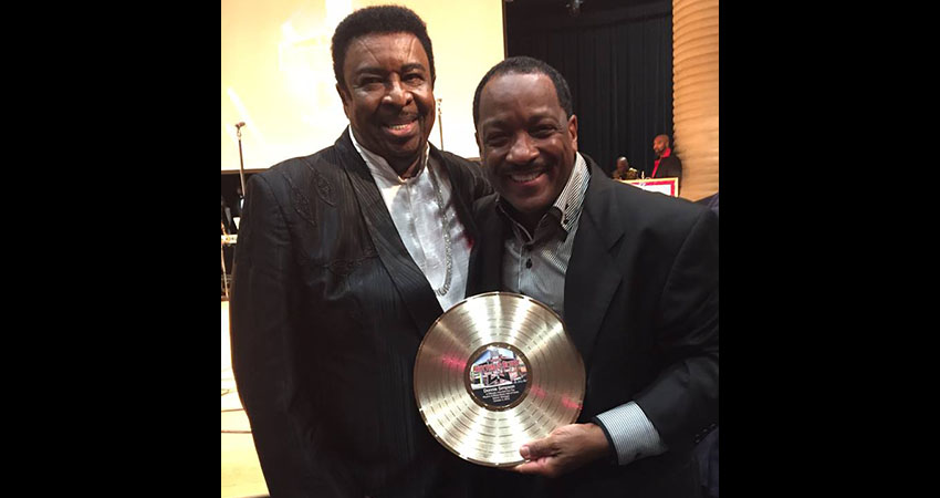 Donnie Simpson with Dennis Edwards holding the national R&B Music Hall of Fame award.