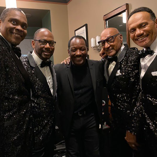 Donnie pictured with The Four Tops.